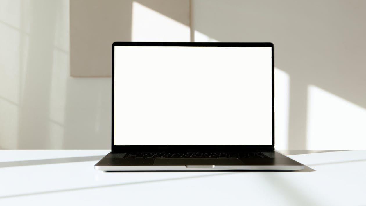 Clean desk with an open laptop showing a privacy checkup screen and a cup of coffee